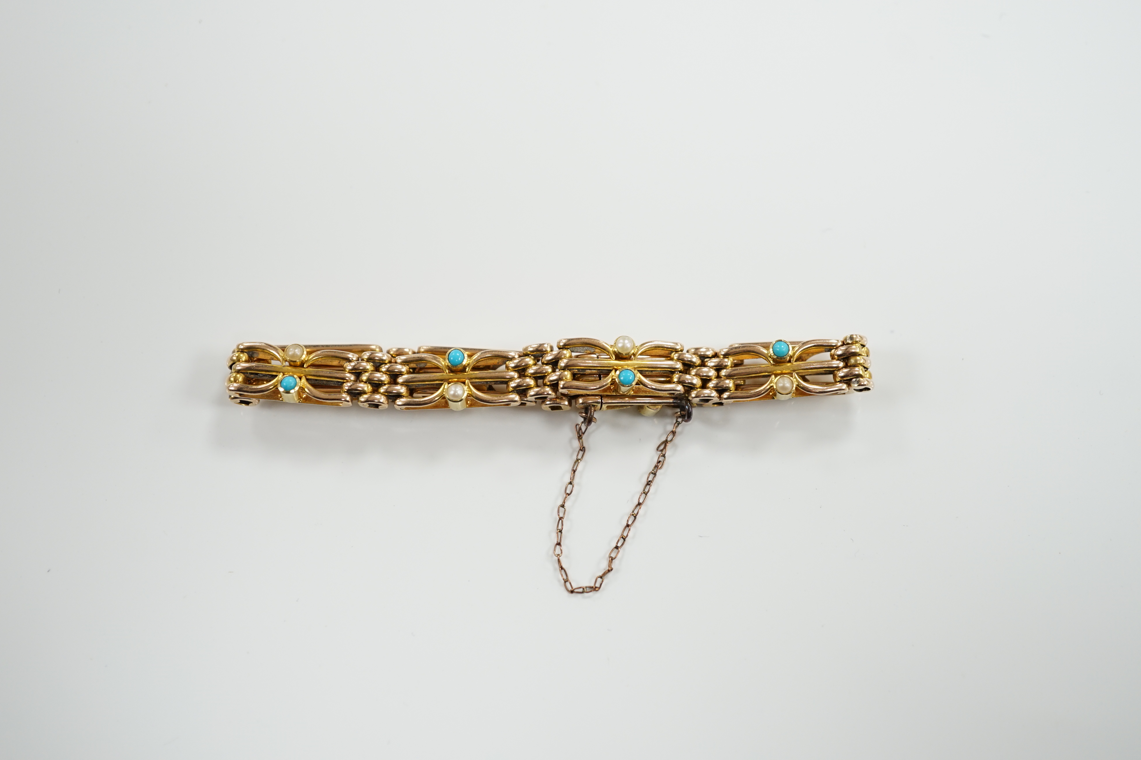 An Edwardian 15ct, turquoise and seed pearl set gate link bracelet, 18cm, gross weight 16.7 grams.